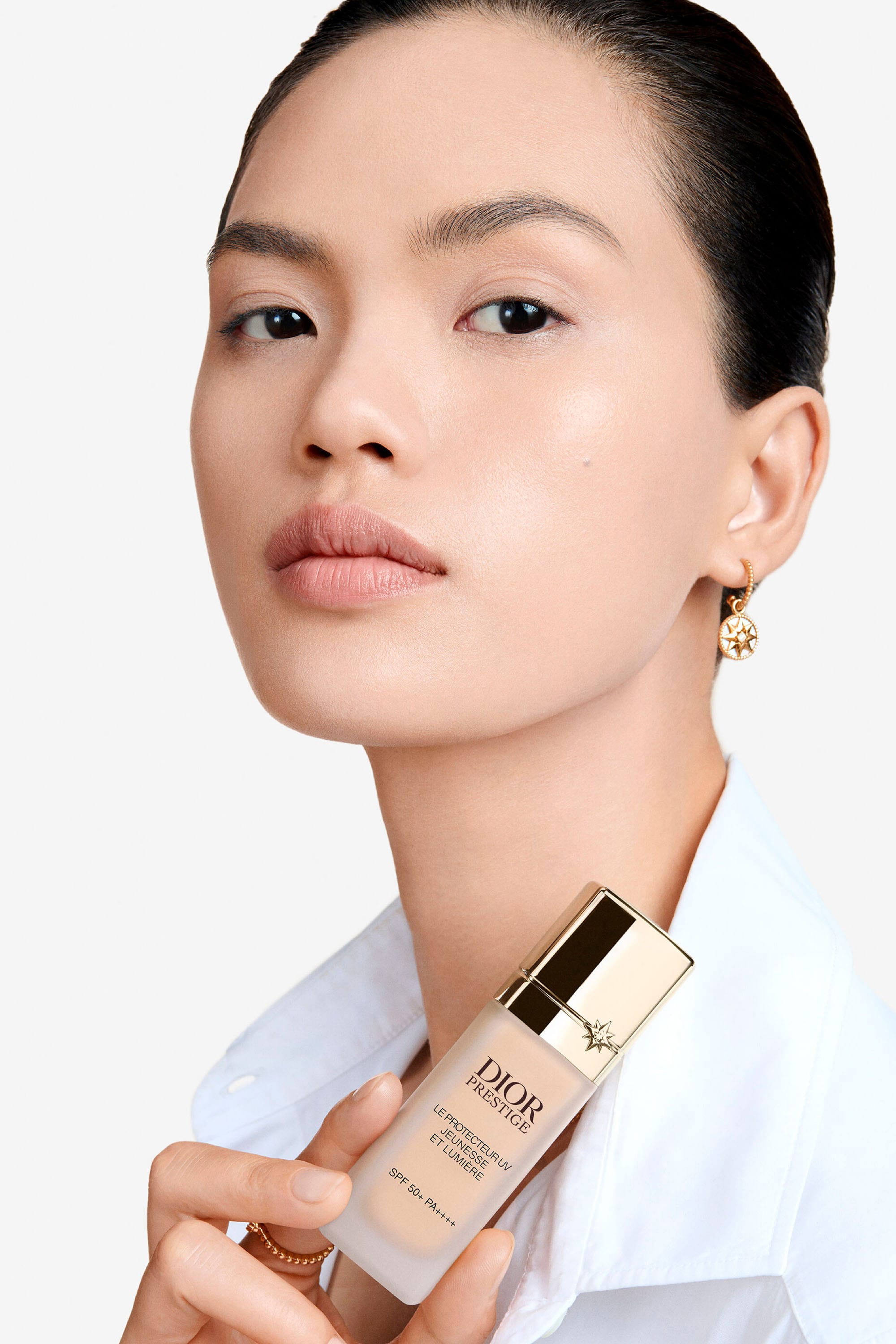 Model&rsquo;s face with product on skin